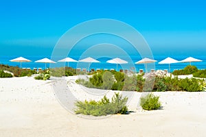 Beautiful landscape of clear turquoise ocean and sandy beach in Saadiyat island photo