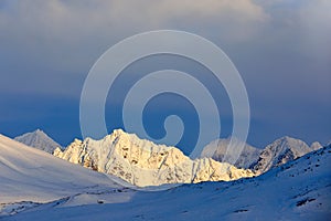 Beautiful landscape. Cold sea water. Land of ice. Travelling in Arctic Norway. White snowy mountain, blue glacier Svalbard, Norwa