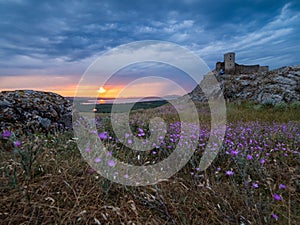 Beautiful landscape and a dramatic sunset sky with storm clouds over Enisala old stronghold citadel