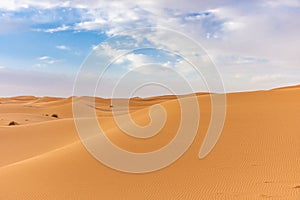 Beautiful landscape of the dunes of the Sahara Desert at dusk, Merzouga, morocco