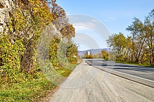 Beautiful landscape with empty road in the mountains in summer or autumn day