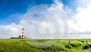 Beautiful landscape with famous Westerheversand lighthouse at North Sea in Nordfriesland, Schleswig-Holstein, Germany