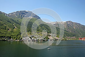 Beautiful landscape in the fjord, with reflections of the mountains in the water. Rosendal, Hardangerfjord, Norway.