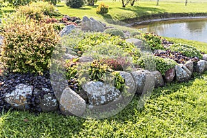 Beautiful landscape with flower garden and pond