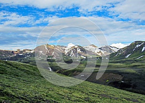 Beautiful landscape of green Hvanngil valley and rhyolite mountains covered with snow, Laugavegur Trail, central Iceland