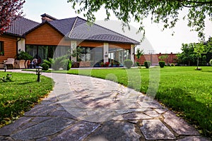 Beautiful landscape with green  near modern house on sunny day