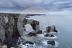 Beautiful landscape image of Green Bridge of Wales on Pembrokeshire Coast in Wales