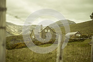 Beautiful landscape of an irish valley,  between mountains. A lonely house /farm in the countryside. Ireland