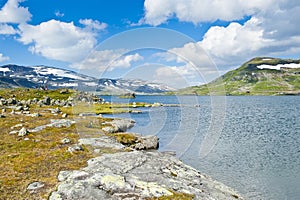 Beautiful landscape with Lake Finsevatnet and snowy mountains in Finse, Norway photo