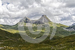 Beautiful landscape in Montenegro with fresh grass and beautiful peaks. Durmitor National Park in Montenegro part of Dinaric Alps.