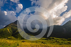 Beautiful landscape mountain green field grass meadow white cloud blue sky on sunny day. Majestic green scenery big mountain hill