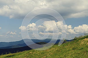 Beautiful landscape with mountain and propeller farm on the top