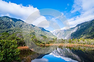 Beautiful landscape of the mountain and the reflection on the lake. Amazing greenery