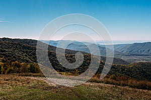 Beautiful landscape of a mountain ridge and a blue sky in the summer season. Marcothsky Range, Gelendzhik, Russia