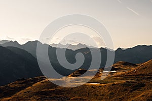 Beautiful landscape with mountain silhouettes in the Alps during sunset photo