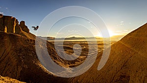 Beautiful landscape of mountains and a silhouette of a biker