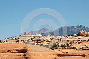 Beautiful landscape in natural colors along Highway 191 in Utah. Sandstone rocks and mountains