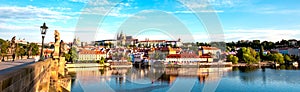 The beautiful landscape of the old town and the Hradcany Prague Castle with St. Vitus Cathedral and St. George church in Prague