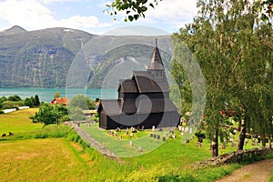 Beautiful landscape with Ornes stave church on lake