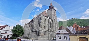 `Biserica Neagra` Church and `Timpa` mountain from Brasov, Romania photo