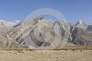 Beautiful landscape in the Pamir mountains. View from Tajikistan towards Afghanistan in the background with the mountain peaks