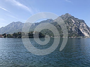 Beautiful landscape, panoramic view mountain and lake Como in Lecco city, Italy, blue water and clear sky background