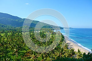 Beautiful landscape of Pantai Nipah, Lombok island scenic travel destination beach with crystal blue waters and coconut trees -