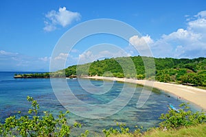 Beautiful landscape of Pantai Nipah, Lombok island scenic travel destination beach with crystal blue waters and coconut trees -