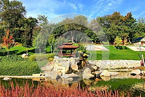 A beautiful landscape park, a lake, wooden pavilions, a red bridge in the Japanese style, Uman, Ukraine, New Sofiyivka. Garden