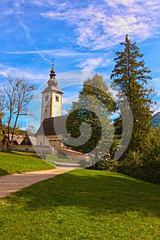 Beautiful landscape photo of Ancient John the Baptist Church near Bohinj lake. Popular travel destination in Slovenia.