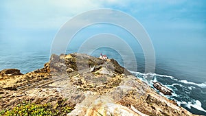 Beautiful landscape, Point Reyes lighthouse on the rocky coast of the Pacific Ocean, a long staircase leads to it