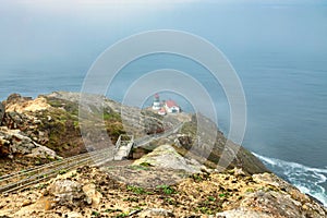 Beautiful landscape, Point Reyes lighthouse on the rocky coast of the Pacific Ocean, a long staircase leads to it