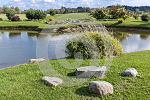 Beautiful landscape with pond, meadow and trees