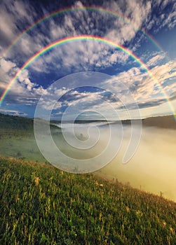 Beautiful landscape with a rainbow in the sky