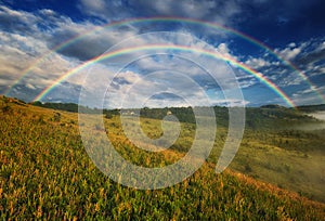 Beautiful landscape with a rainbow in the sky