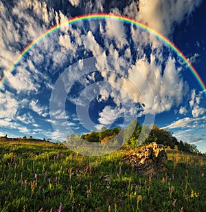 Beautiful landscape with a rainbow in the sky