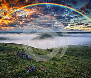 Beautiful landscape with a rainbow in the sky