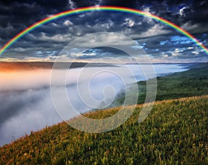 Beautiful landscape with a rainbow in the sky