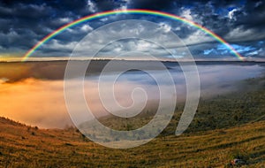 Beautiful landscape with a rainbow in the sky