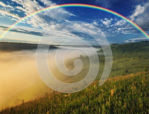 Beautiful landscape with a rainbow in the sky