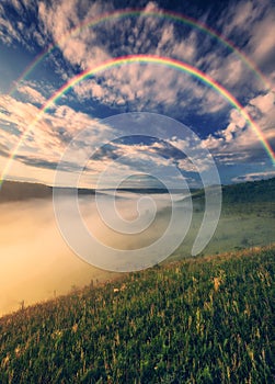 Beautiful landscape with a rainbow in the sky