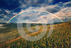 Beautiful landscape with a rainbow in the sky