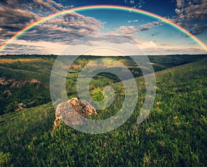 Beautiful landscape with a rainbow in the sky