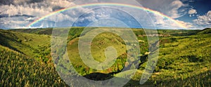 Beautiful landscape with a rainbow in the sky