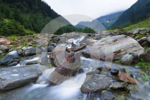 Beautiful landscape of rapids on a mountain river. Long exposure image. Fagaras Mountains.Transylvania. Romania.