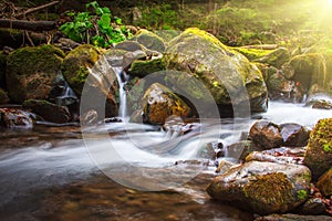 Beautiful landscape rapids on a mountains river in sunlight.