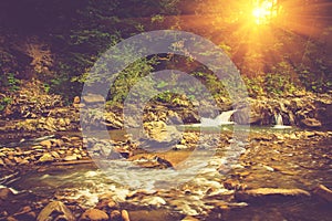 Beautiful landscape of rapids on a mountains river in sunrise.