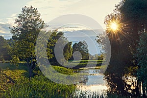 Beautiful landscape of river at sunset in summer.