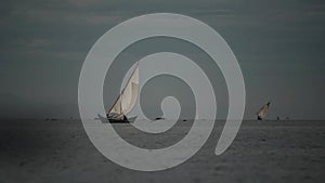 Beautiful landscape of the sailboat in the early morning. Ship with people is going fishing in sea in Africa.