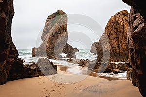 Beautiful landscape of sandy ocean beach with stones and rocks